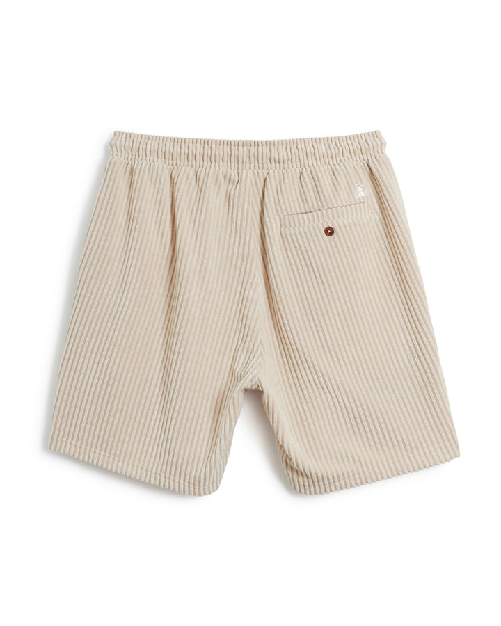 A pair of The Tropez Jacquard Shorts - Scallop Stripe from Dandy Del Mar, featuring a beige and white pattern with an elastic waistband and a single buttoned back pocket.