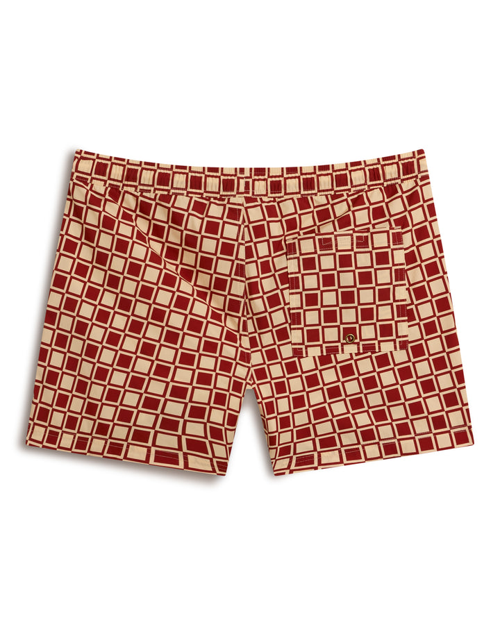 The Ventura Volley Short - Rouge by Dandy Del Mar features a red and beige checkered design, elastic waistband, and back pocket.