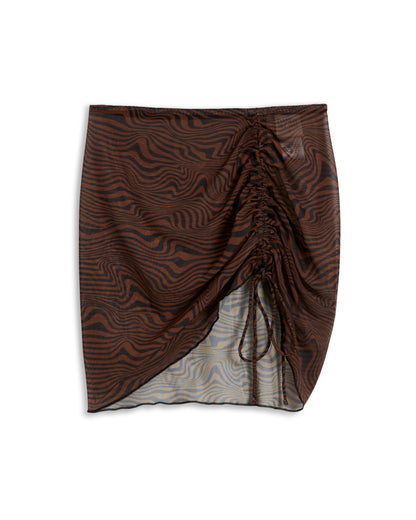 Discover The Athena Skirt - Onyx by Dandy Del Mar, an ideal choice for the fashion-savvy beachgoer. Featuring a stunning brown and black wavy pattern, this skirt includes adjustable side ruching and a drawstring detail. It's crafted from breathable mesh fabric to ensure chic comfort.