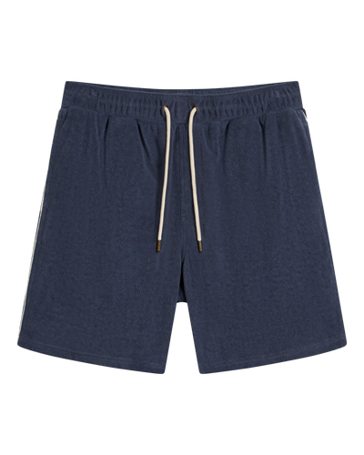 The Gaucho Terry Cloth Shorts - Moontide by Dandy Del Mar in navy blue, featuring an elastic waistband, beige drawstring, and side pockets, shown against a white background.