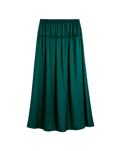 The Monaco Maxi Skirt - Albero by Dandy Del Mar: an emerald green satin maxi skirt with an elastic waistband and a slightly flared silhouette, shown on a plain background.