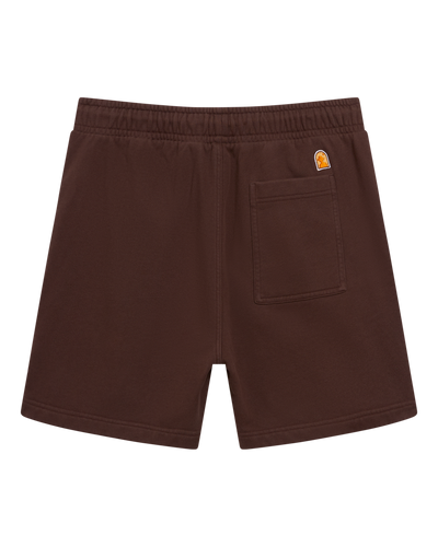 Back view of The Marseille French Terry Shorts - Carajillo by Dandy Del Mar, featuring an elastic waistband, right back pocket, and a small patch logo above the pocket in brown.